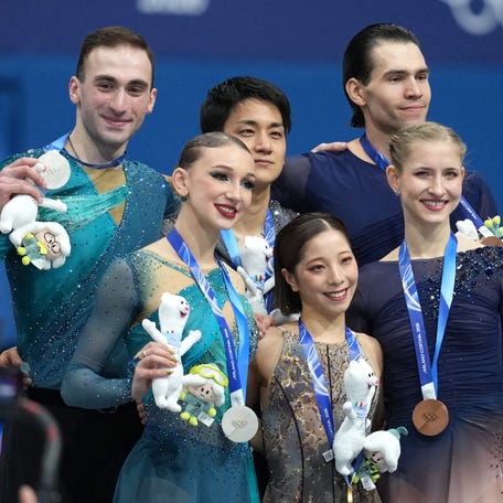 Riku Miura and Ryuichi Kihara of Japan win gold, Anastasiia Metelkina and Luka Berulava of Georgia win silver, and Minerva Fabienne Hase and Nikita Volodin of Germany win bronze in the pairs free skate during the Milano Cortina 2026 Olympic Winter Games.