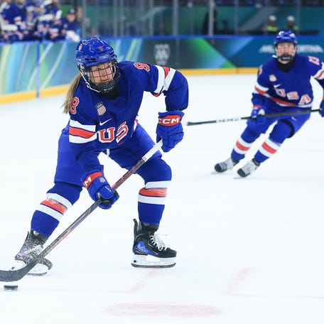 Haley Winn (8) of the United States looks to pass during the first period against Sweden in a women's ice hockey semifinal during the Milano Cortina 2026 Olympic Winter Games at Milano Santagiulia Ice Hockey Arena on Feb 16, 2026 in Milan, Italy.