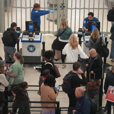 TSA agents screen and direct passengers at John Glenn International Airport in Columbus, Ohio October 3, 2025.