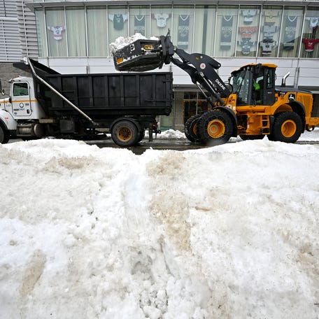 City trucks remove snow on Commercial Street on Wednesday, Feb. 18.