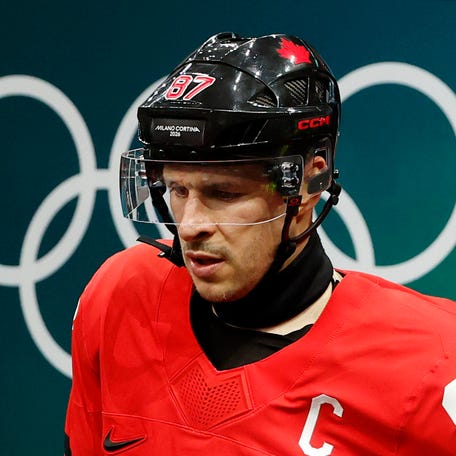 Feb 18, 2026; Milan, Italy; Sidney Crosby of Canada walks out to the ice before a men's ice hockey quarterfinal during the Milano Cortina 2026 Olympic Winter Games at Milano Santagiulia Ice Hockey Arena. Mandatory Credit: Geoff Burke-Imagn Images