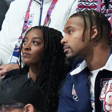 Simone Biles looks on during the men's figure skating competition at Milano Ice Skating Arena on Feb. 13, 2026.