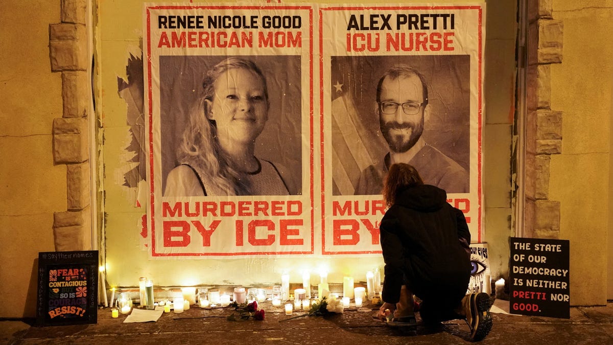 Posters of Renee Good and Alex Pretti at an impromptu memorial Jan. 28, 2026, after they were fatally shot by federal agents in Minneapolis.
