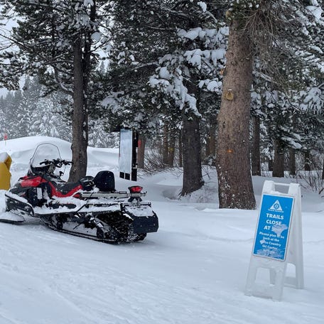 A snowmobile is parked at Alder Creek Adventure Center, one of two sites where search crews were launched to try to locate a group of missing skiers after an avalanche in a backcountry slope of California's Sierra Nevada mountains, in Truckee, California, on Feb. 18, 2026.