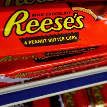 Packets of Reese's peanut butter cups, a Hershey product, are displayed at a gas station in Phoenix, Arizona on Oct. 27, 2011.