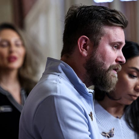FILE PHOTO: Virginia Giuffre's brother, Sky Roberts, and his wife, Amanda Roberts, speak as they take part in introducing Virginia's Law, legislation that aims to eliminate the statute of limitations for sex traffickers and abusers, with survivors of late financier and convicted sex offender Jeffrey Epstein and U.S. Senate Minority Leader Chuck Schumer (D-NY) (not pictured), on Capitol Hill in Washington,   D.C., U.S., February 10, 2026. REUTERS/Anna Rose Layden/File Photo