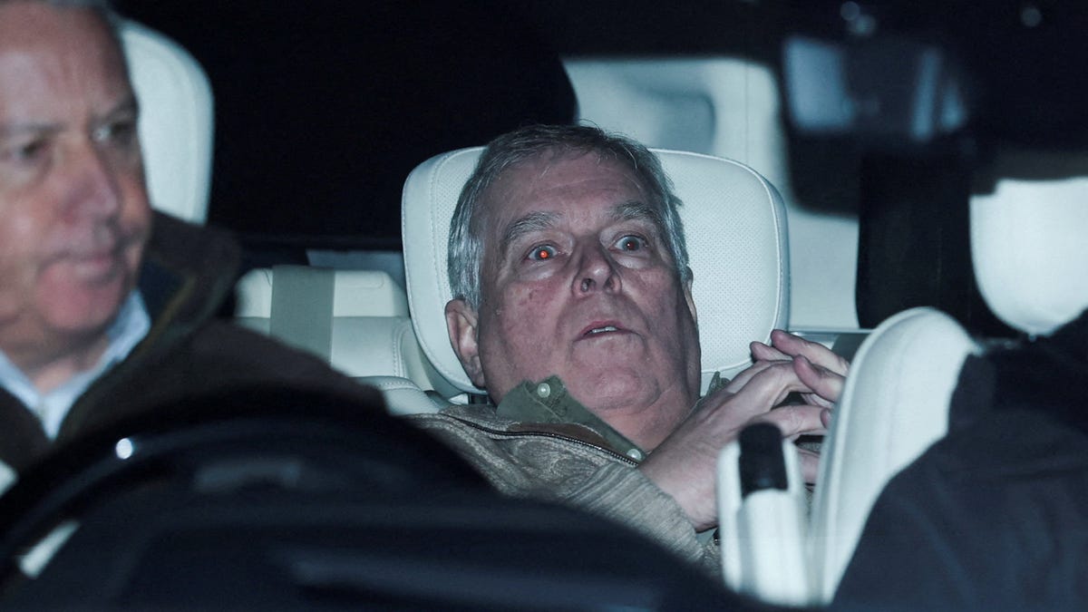 Andrew Mountbatten-Windsor, the younger brother of the British King Charles and who's formerly known as Prince Andrew, leaves a police station in a vehicle in Aylsham, England, on Feb. 19, 2026, the day he was arrested on suspicion of misconduct in public office.