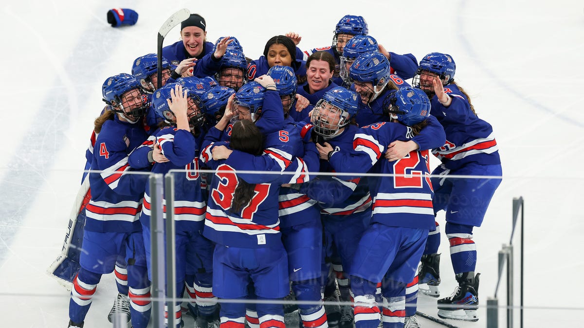 Players of Team United States celebrate winning the gold medals after the team's 2-1 overtime victory in the Women's Gold Medal match between the United States and Canada on day thirteen of the Milano Cortina 2026 Winter Olympic games at Milano Santagiulia Ice Hockey Arena on Feb. 19, 2026 in Milan, Italy.
