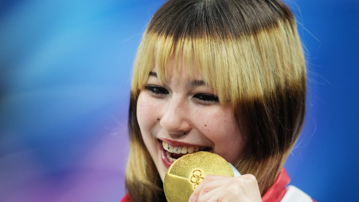 Alysa Liu of the United States celebrates with the gold medal in the women's free skate during the Milano Cortina 2026 Olympic Winter Games.