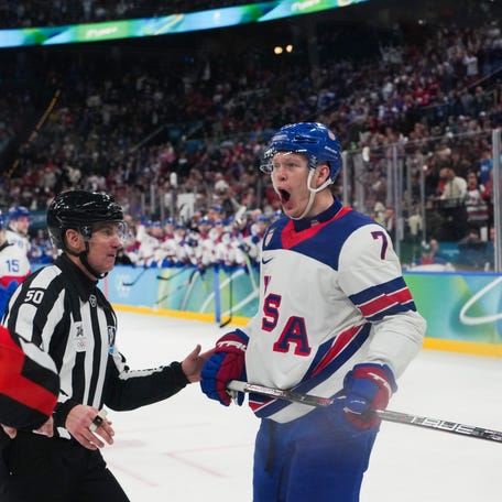 Brady Tkachuk (7) of the United States celebrates a goal scored by Jack Eichel.