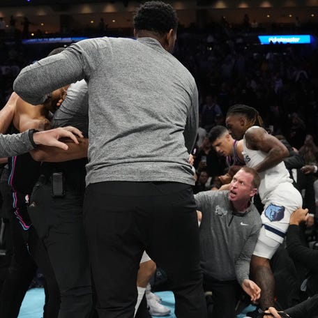 A fight breaks out late in the game between Miami Heat forward Myron Gardner (15) and Memphis Grizzlies guard Scotty Pippen Jr. (1) at Kaseya Center on Feb. 21, 2026.