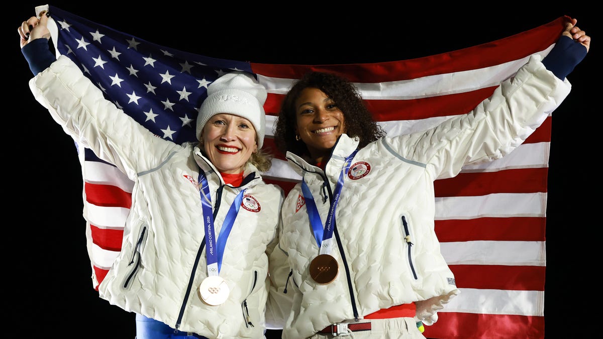 CORTINA D'AMPEZZO, ITALY - FEBRUARY 21: Bronze medalists Kaillie Armbruster Humphries and Jasmine Jones of Team United States pose on the podium during the medal ceremony for the Bobsleigh Two-Woman on day fifteen of the Milano Cortina 2026 Winter Olympic games at Cortina Sliding Centre on February 21, 2026 in Cortina d'Ampezzo, Italy. (Photo by Ezra Shaw/Getty Images)