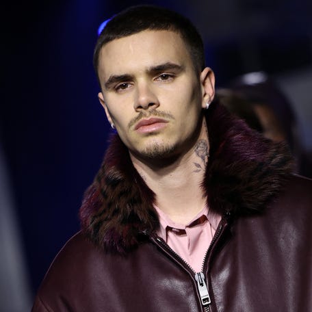 Romeo Beckham walks the runway during Burberry's fall/winter 2026 show in London.