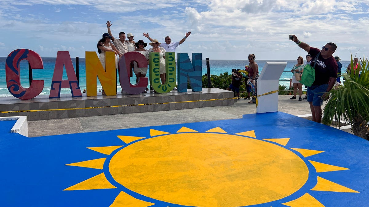 'They're freaking out.' Should travelers cancel their Cancun trips?