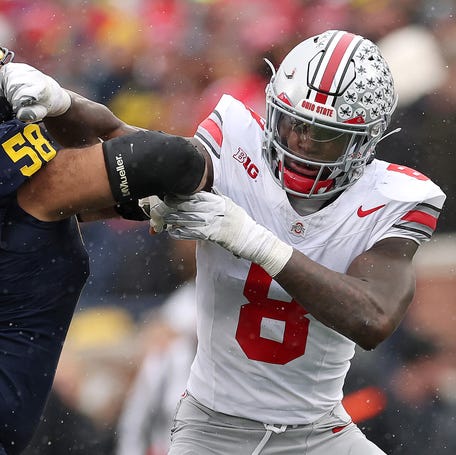 Arvell Reese #8 of the Ohio State Buckeyes in action against Giovanni el-Hadi #58 of the Michigan Wolverines at Michigan Stadium on November 29, 2025 in Ann Arbor, Michigan.