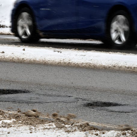 A pothole formed around a previous patch up on West Boylston Street in Worcester.