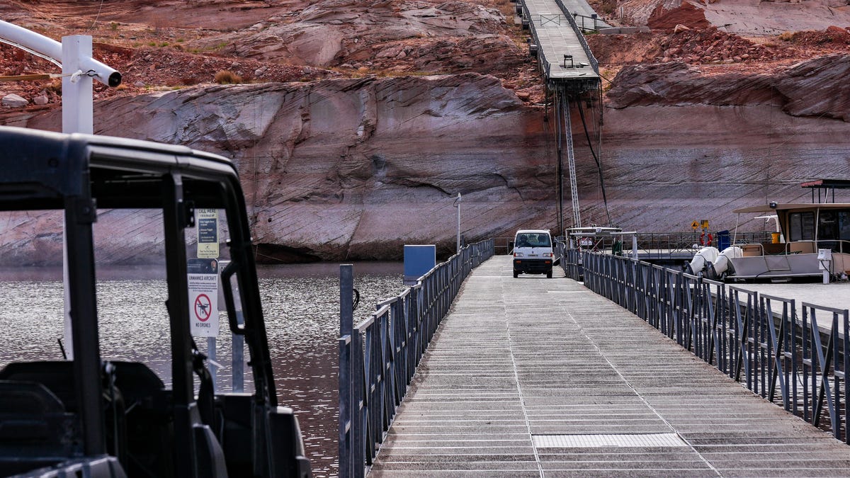 Low water levels in Lake Powell are apparent in this February 2026 image showing the end of a floating dock hanging off a cliff at Antelope Marina in Page, Arizona. Workers carved a new path to the water through the solid rock.
