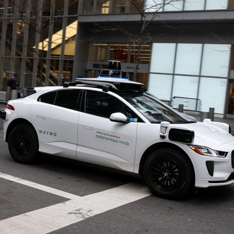 Waymo driverless taxi drives in lower Manhattan in New York City, U.S., November 26, 2025. REUTERS/Brendan McDermid
