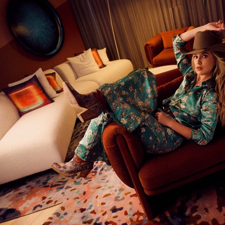 Lainey Wilson is a singer, songwriter, and actress from a small town in Louisiana. She skyrocketed to fame in 2022, winning the Country Music Association's New Artist of the Year award that year. Today, she performs around the world. Here she is pictured before a concert in Brisbane, Australia.