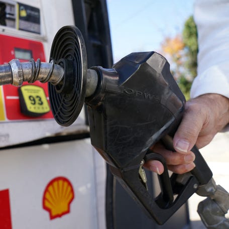 A customer uses a gas pump at a filling station in Falls Church, Virginia, U.S., October 20, 2022.