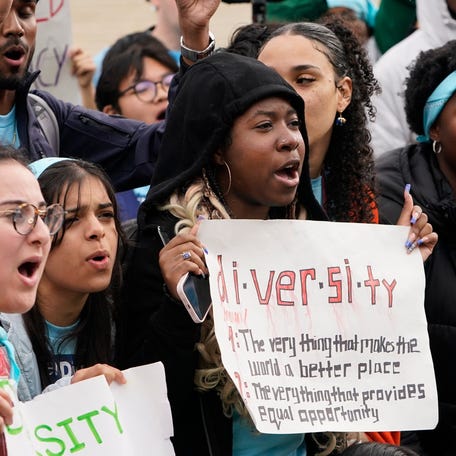 Protesters gather outside as the U.S. Supreme Courts hears oral arguments in two affirmative action college admission cases on Oct. 31, 2022.
