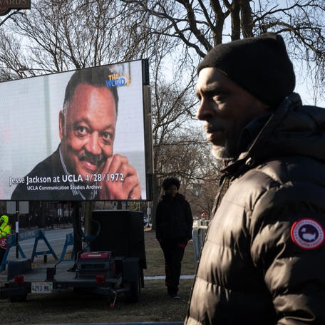 People watch as the remains of civil rights leader Rev. Jesse Jackson arrive at the Rainbow Push national headquarters where they will lie in repose on Feb. 26, 2026 in Chicago, Illinois. The US civil rights leader Jesse Jackson died on February 17.