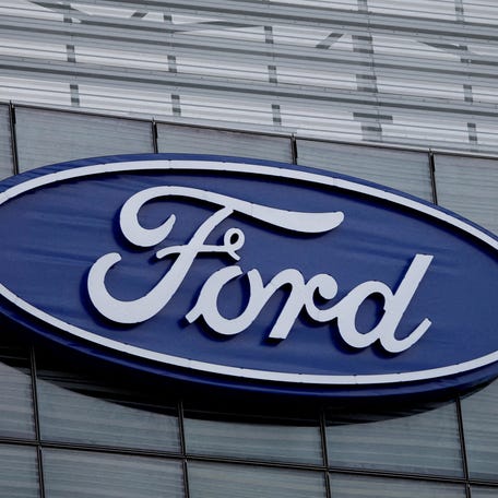 The blue Ford oval logo is displayed on the new Ford World Headquarters in Dearborn, Michigan, U.S. November 16, 2025.