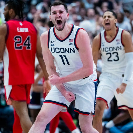 Connecticut forward Alex Karaban reacts to a play during his team's game against St. John's at PeoplesBank Arena in Hartford.