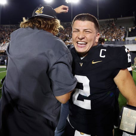 Diego Pavia #2 of the Vanderbilt Commodores and comedian Theo Vonn celebrate after an overtime victory against the Auburn Tigers at FirstBank Stadium on November 08, 2025 in Nashville, Tennessee.