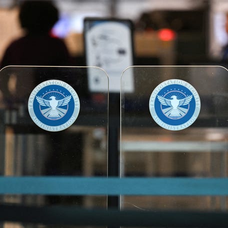A Transportation Security Administration gate sits closed at Ronald Reagan Washington National Airport in Arlington, Virginia on Feb. 14, 2026.