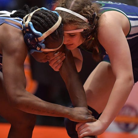Jillian Giller, right, competes at last year's Illinois High School Association finals.