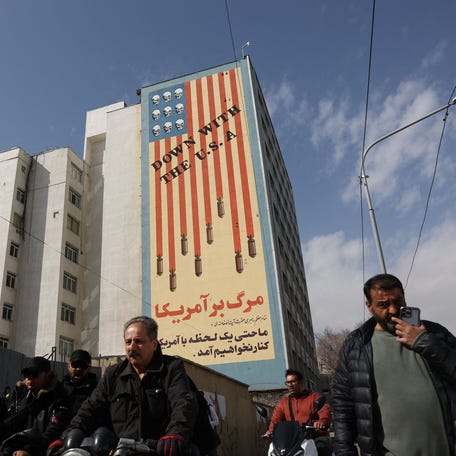 A graffiti on a wall reads" Down with the U.S.A", after Israel said it launched a pre-emptive attack against Iran, in Tehran, Iran, February 28, 2026.