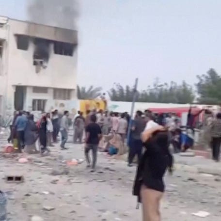 Black smoke rises from a destroyed building at a school where, as the state media reports, several people were killed in an Israeli airstrike, following strikes by the United States and Israel against Iran, in Minab, Iran, in this screengrab obtained from a social media video released on February 28, 2026.