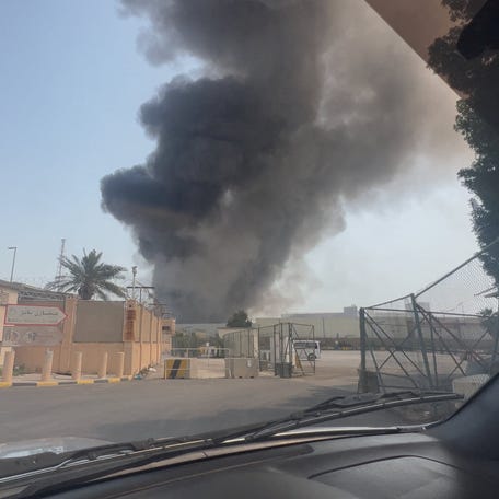 Smoke rises from the direction of the U.S. naval base after the state news agency reported missile attack on the service center of the U.S. Fifth Fleet, following strikes by the United States and Israel against Iran, in Manama, Bahrain February 28, 2026, in this screengrab obtained from a social media video. Video obtained by Reuters/via REUTERS THIS IMAGE HAS BEEN SUPPLIED BY A THIRD PARTY. NO RESALES. NO ARCHIVES.   VERIFICATION: -Buildings, road layout and utility poles matched file and satellite imagery and corroborating verified visuals -Date verified by original files metadata -Bahrain said that the service center of the U.S. Fifth Fleet had been subjected to a missile attack -Smoke is coming from the direction of the U.S. Naval Base in Manama, Bahrain