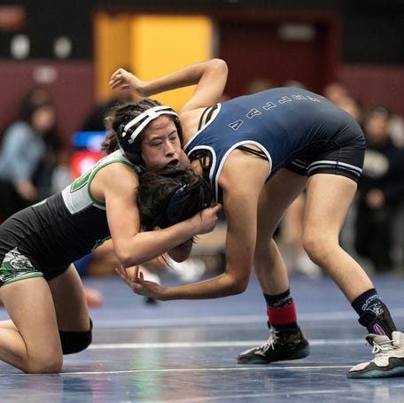 Victor Valley's Naomi Razo wrestles Santa Ana's Wendy Amaro at the CIF-SS Northern Division Individual Championships, hosted by Adelanto High School on Friday, Feb. 13, 2026.