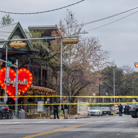 Members of the FBI and local law enforcement investigate after a mass shooting outside of Buford's bar in downtown on March 1, 2026 in Austin, Texas. Three people are dead and 14 others are hospitalized following a mass shooting early Sunday morning.