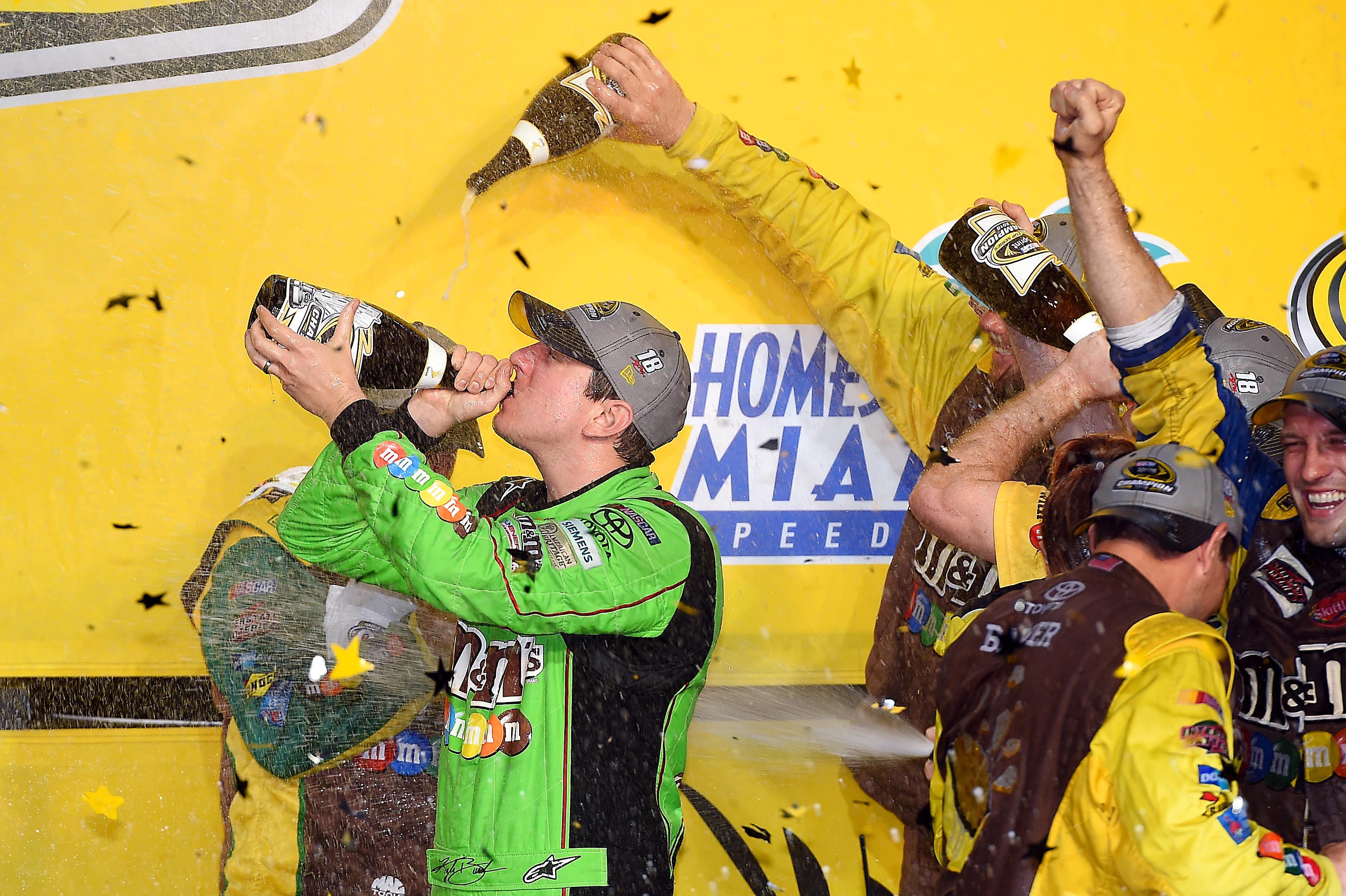 Kyle Busch celebrates after winning the NASCAR Sprint Cup Champion.