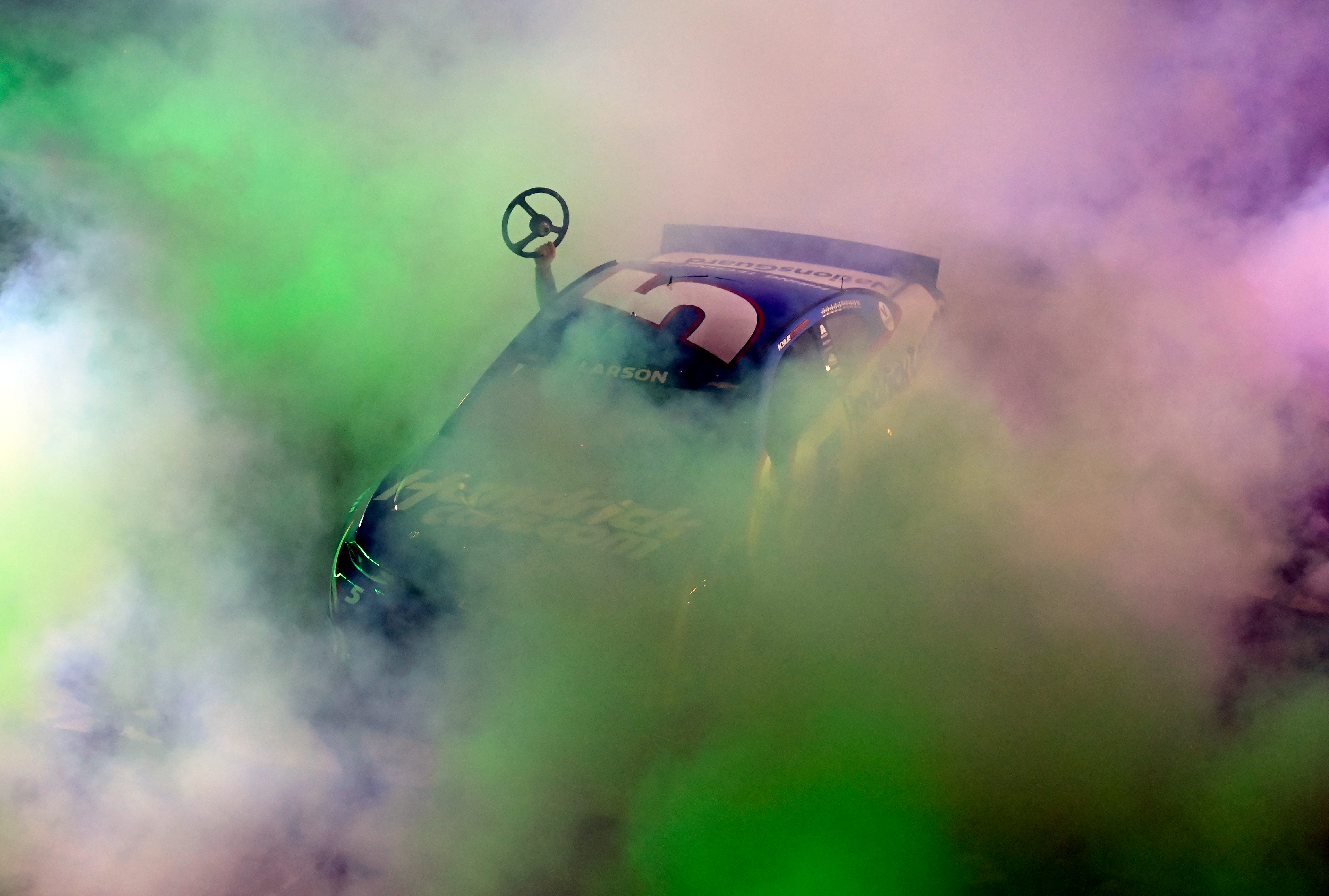NASCAR driver Kyle Larson's car during a burnout.