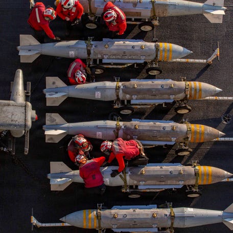 U.S. Navy sailors prepare to stage ordnance on the flight deck of the Nimitz-class aircraft carrier USS Abraham Lincoln in support of the attack on Iran on Feb. 28, 2026.