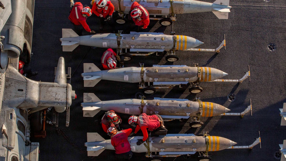 U.S. Navy sailors prepare to stage ordnance on the flight deck of the Nimitz-class aircraft carrier USS Abraham Lincoln in support of the attack on Iran on Feb. 28, 2026.