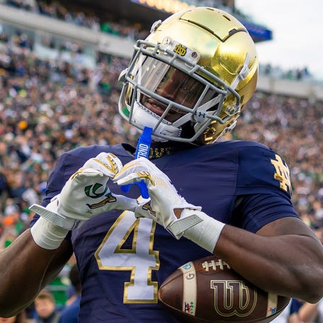 Nov 22, 2025; South Bend, Indiana, USA; Notre Dame Fighting Irish running back Jeremiyah Love (4) celebrates scoring against the Syracuse Orange during the first half at Notre Dame Stadium. Mandatory Credit: Michael Caterina-Imagn Images