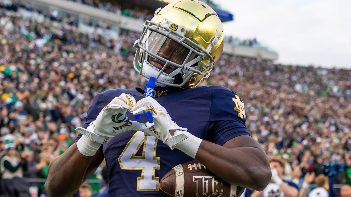 Nov 22, 2025; South Bend, Indiana, USA; Notre Dame Fighting Irish running back Jeremiyah Love (4) celebrates scoring against the Syracuse Orange during the first half at Notre Dame Stadium. Mandatory Credit: Michael Caterina-Imagn Images