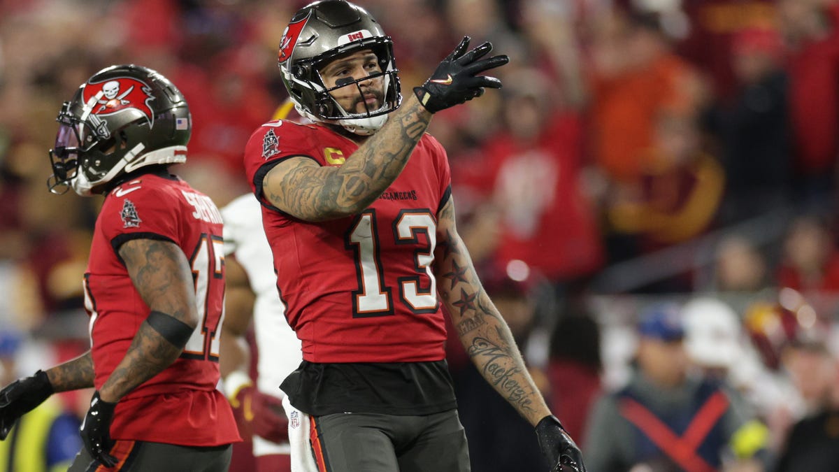 Jan 12, 2025; Tampa, Florida, USA; Tampa Bay Buccaneers wide receiver Mike Evans (13) reacts after a first down during the third quarter of a NFC wild card playoff against the Washington Commanders at Raymond James Stadium. Mandatory Credit: Nathan Ray Seebeck-Imagn Images