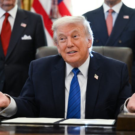 US President Donald Trump speaks before signing executive orders in the Oval Office in the White House in Washington, DC, on January 30, 2026.