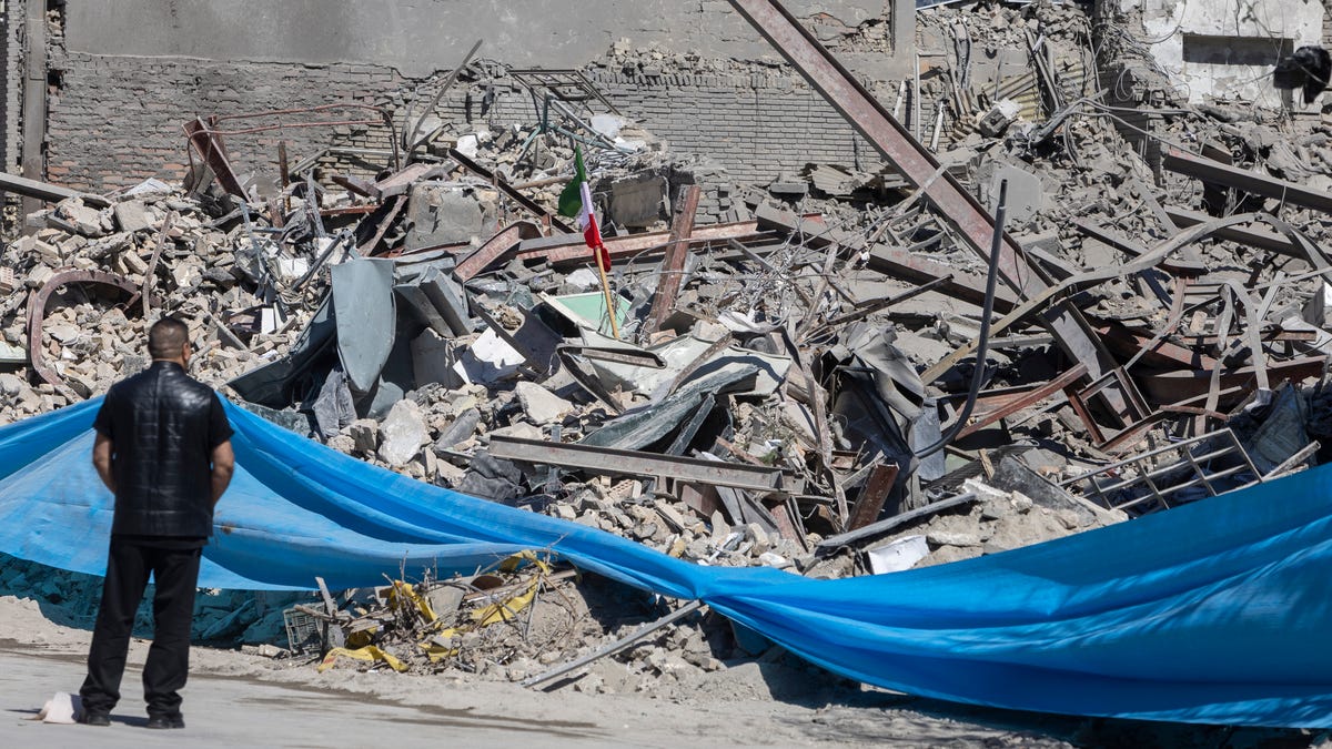 A man looks at rubble of a police station, damaged in airstrikes yesterday, on March 3, 2026 in Tehran, Iran.
