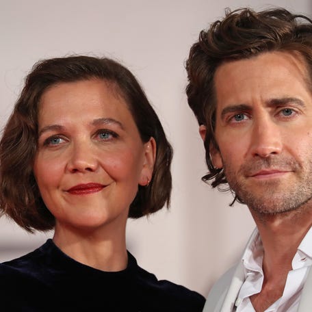 Maggie Gyllenhaal, left, and Jake Gyllenhaal attend the red carpet for "The Lost Daughter" during the Venice International Film Festival on Sept. 3, 2021, in Venice, Italy.