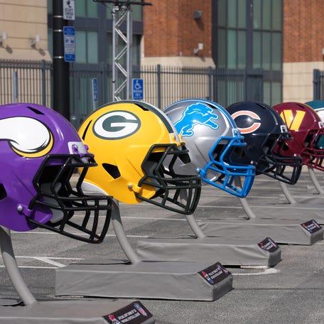 Feb 26, 2026; Indianapolis, IN, USA; Large helmets of the Minnesota Vikings, Green Bay Packers, Detroit Lions, Chicago Beras, Washington Commanders and Philadelphia Eagles at the NFL Scouting Combine at Lucas Oil Stadium. Mandatory Credit: Kirby Lee-Imagn Images