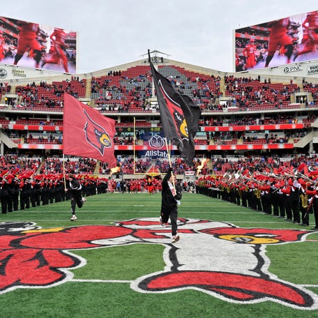 Nov 29, 2025; Louisville, Kentucky, USA; The Louisville Cardinals take the field before the first quarter against the Kentucky Wildcats at L&N Federal Credit Union Stadium. Mandatory Credit: Jamie Rhodes-Imagn Images