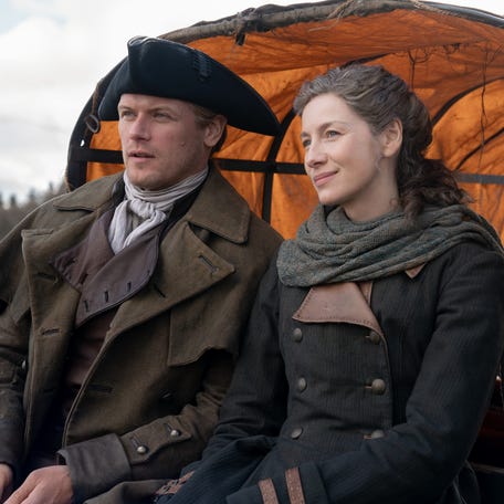 Sam Heughan as Jamie Fraser and Caitríona Balfe as Claire Fraser in the time-travelling drama "Outlander."