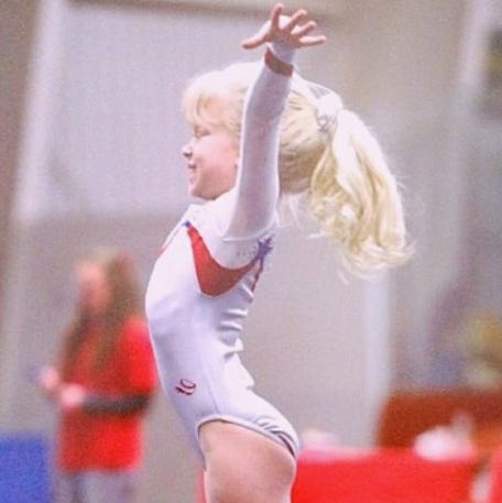 Anna Baker, shown as a young girl, says all she ever wanted to be was a gymnast.